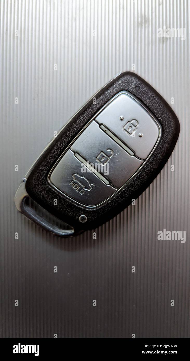 a vehicle keyless entry smart remote key with buttons for different locking and unlocking functions Stock Photo