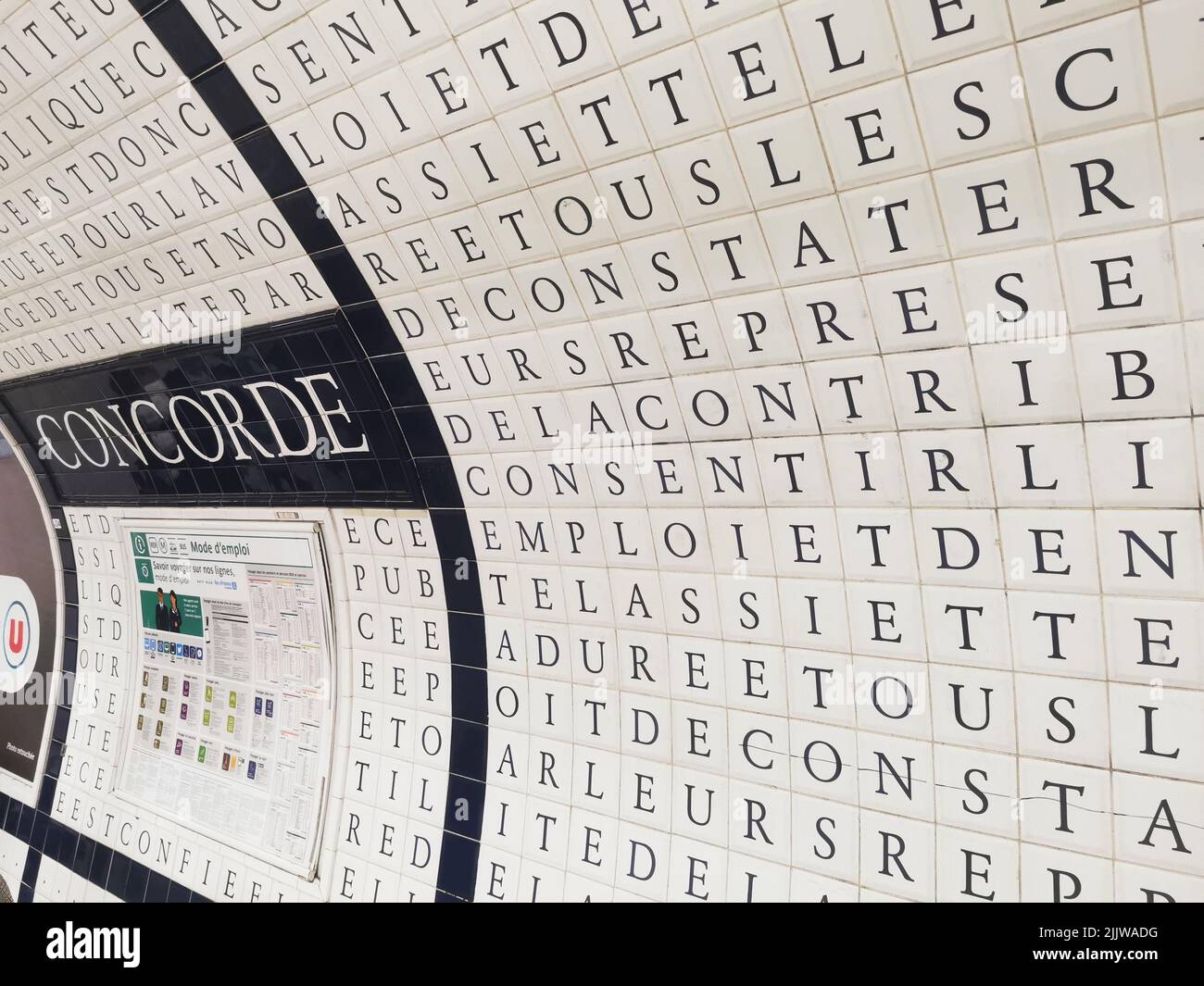 picture of the typical Look of a Metro Station in Paris Underground (unser the Place de la Concorde) and its mosaics with numerous letters Stock Photo