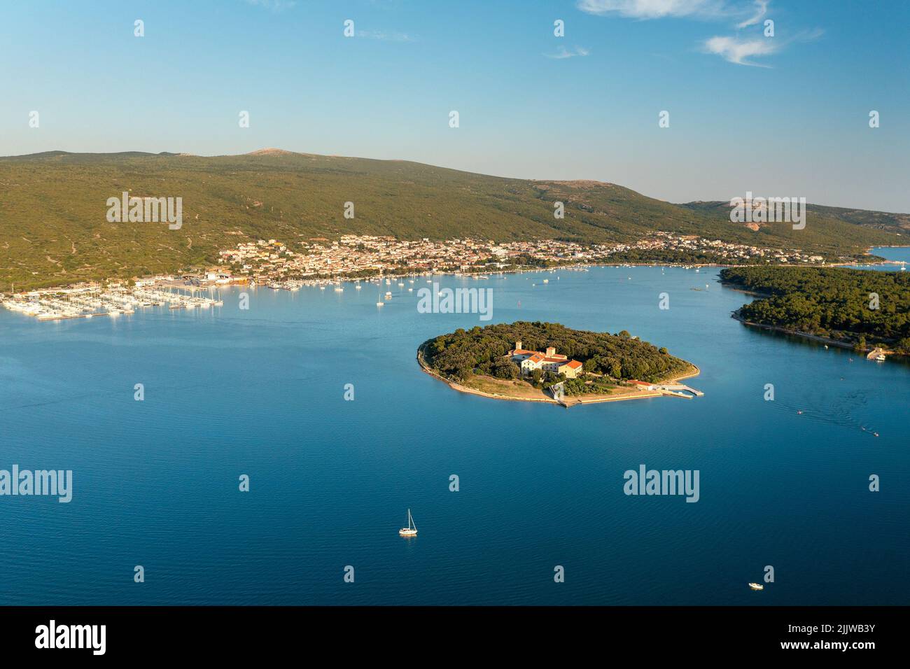 Aerial view of Kosljun monastery with Punat town in the background, Krk island, Croatia Stock Photo