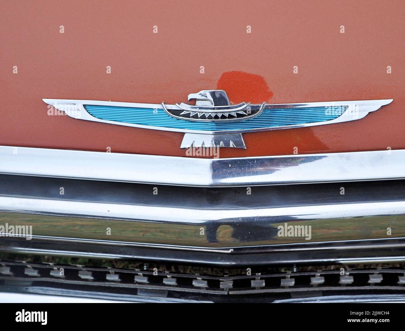 The close-up view of the Ford thunderbird logo on the red classic car Stock Photo
