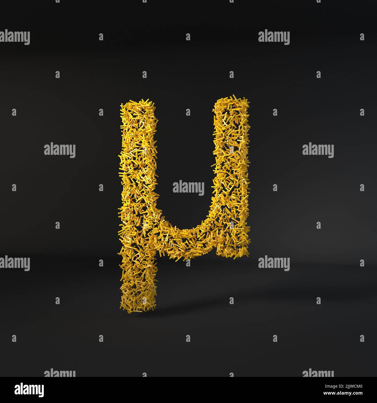 Scattered yellow letter isolated over a black background Stock Photo