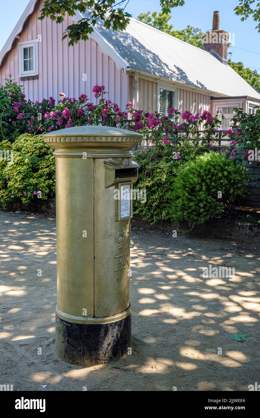 The formerly blue post box on the island of Sark in the Bailiwick of Guernsey was painted gold by Guernsey Post to commemorate Carl Hester's gold meda Stock Photo