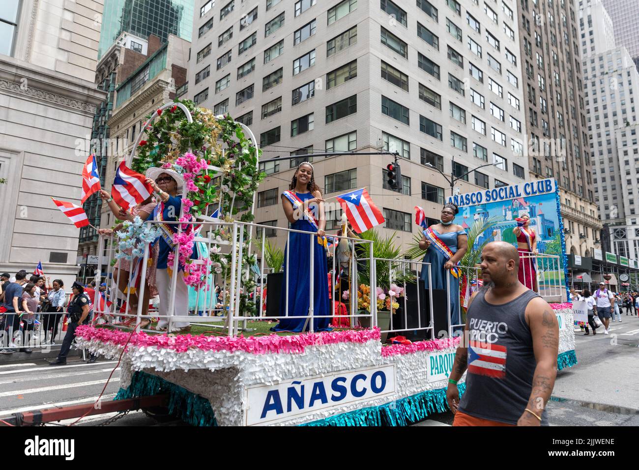 The large crowds of people in the streets of Manhattan celebrating the