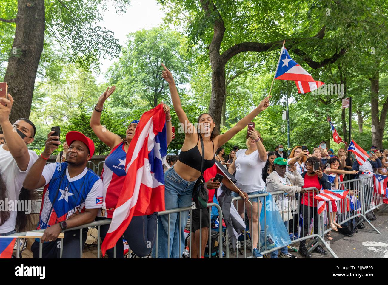 The large crowds of people in the streets of Manhattan celebrating the