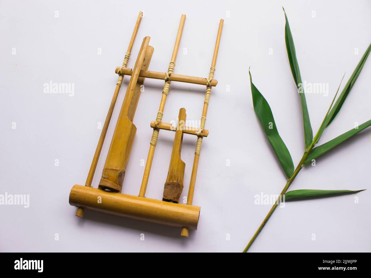 Angklung, the traditional sundanese musical instrument made from bamboo.  Isolated on white background Stock Photo - Alamy