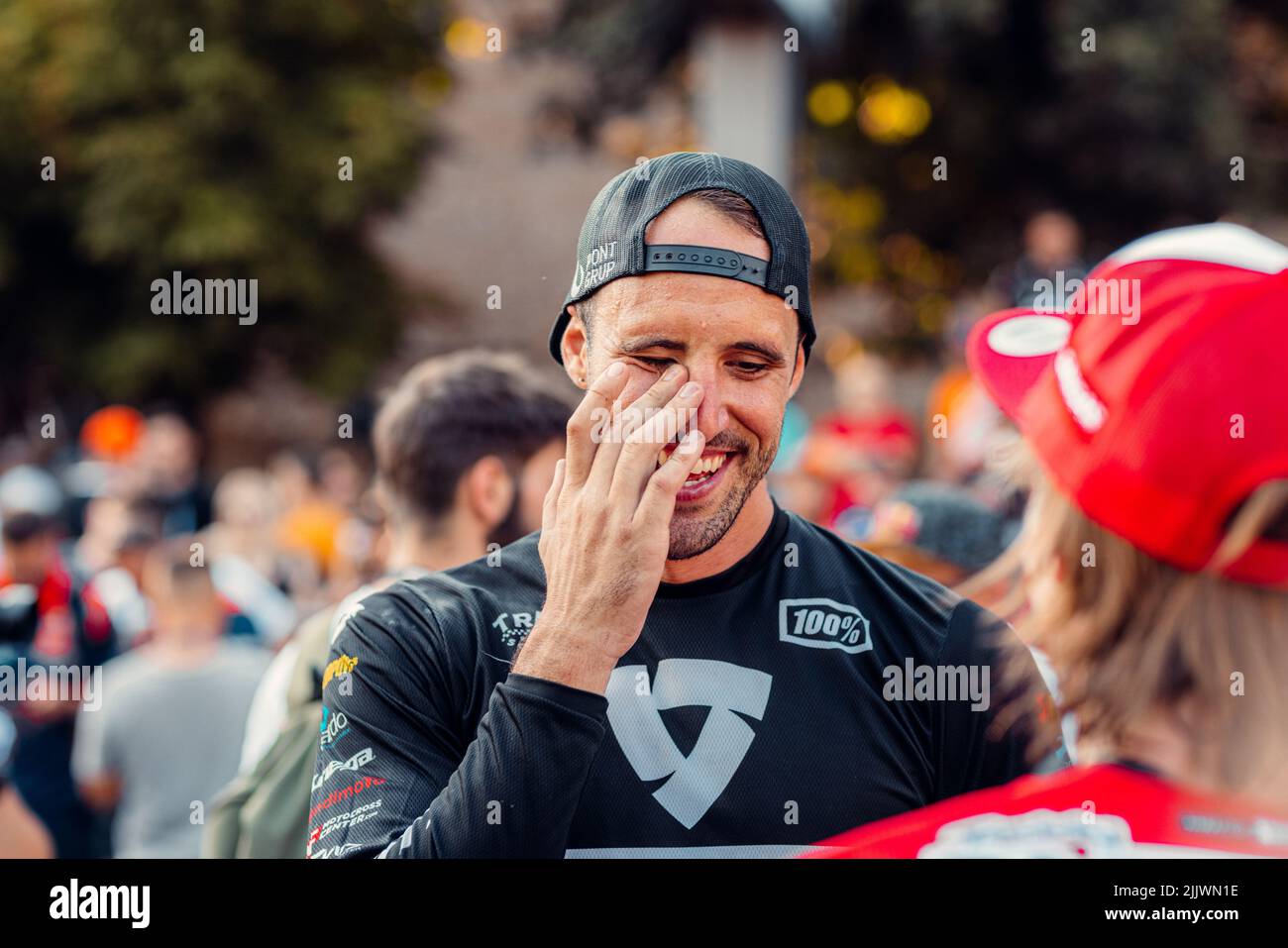 a laughing sportsman during Red Bull Romaniacs hard enduro Rallye - Prolog in Sibiu city, Romania Stock Photo