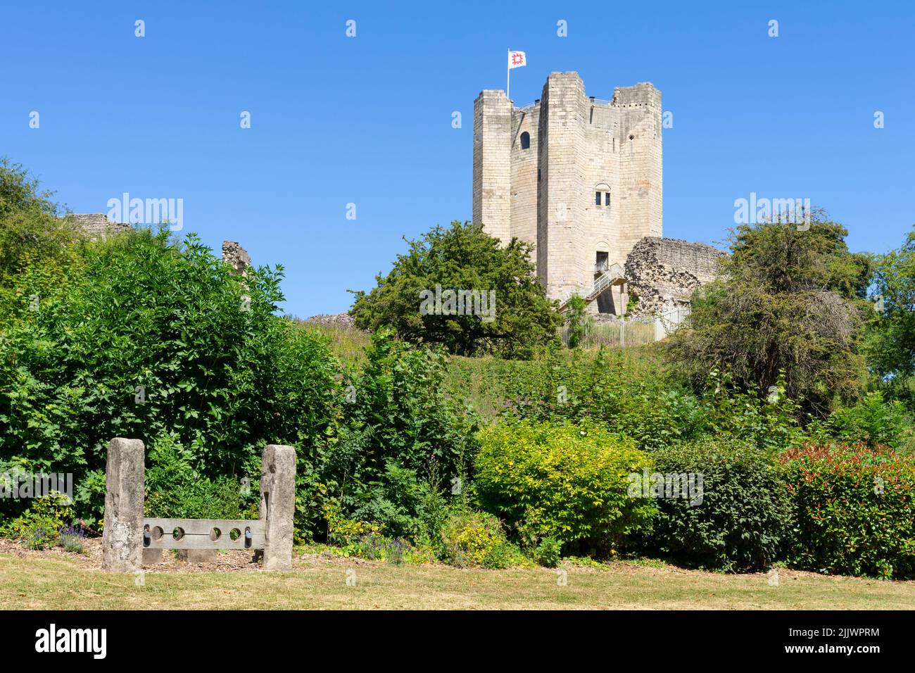 Conisbrough Castle ruins of Conisbrough castle above Coronation park with stocks in Conisbrough near Doncaster South Yorkshire England Uk GB Europe Stock Photo