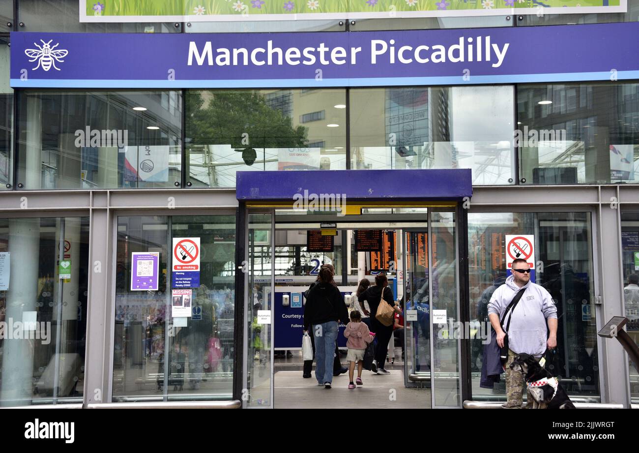 Travellers or passengers at an entrance to Piccadilly Rail station, Manchester, England, United Kingdom, British Isles. Trade union Aslef said today that train drivers at nine rail companies will strike for another 24 hours on August 13th, 2022, over pay. Aslef says the firms failed to make a pay offer to help members keep pace with increases in the cost of living. Stock Photo
