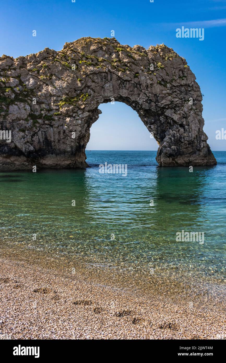 Durdle Door (sometimes Durdle Dor) is a natural limestone arch on the Jurassic Coast near