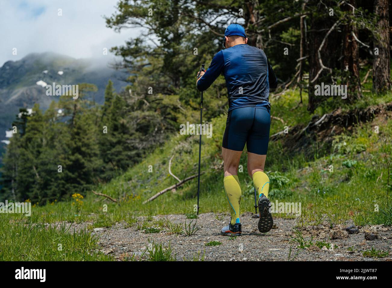 male athlete with trekking poles during vertical kilometer Stock Photo