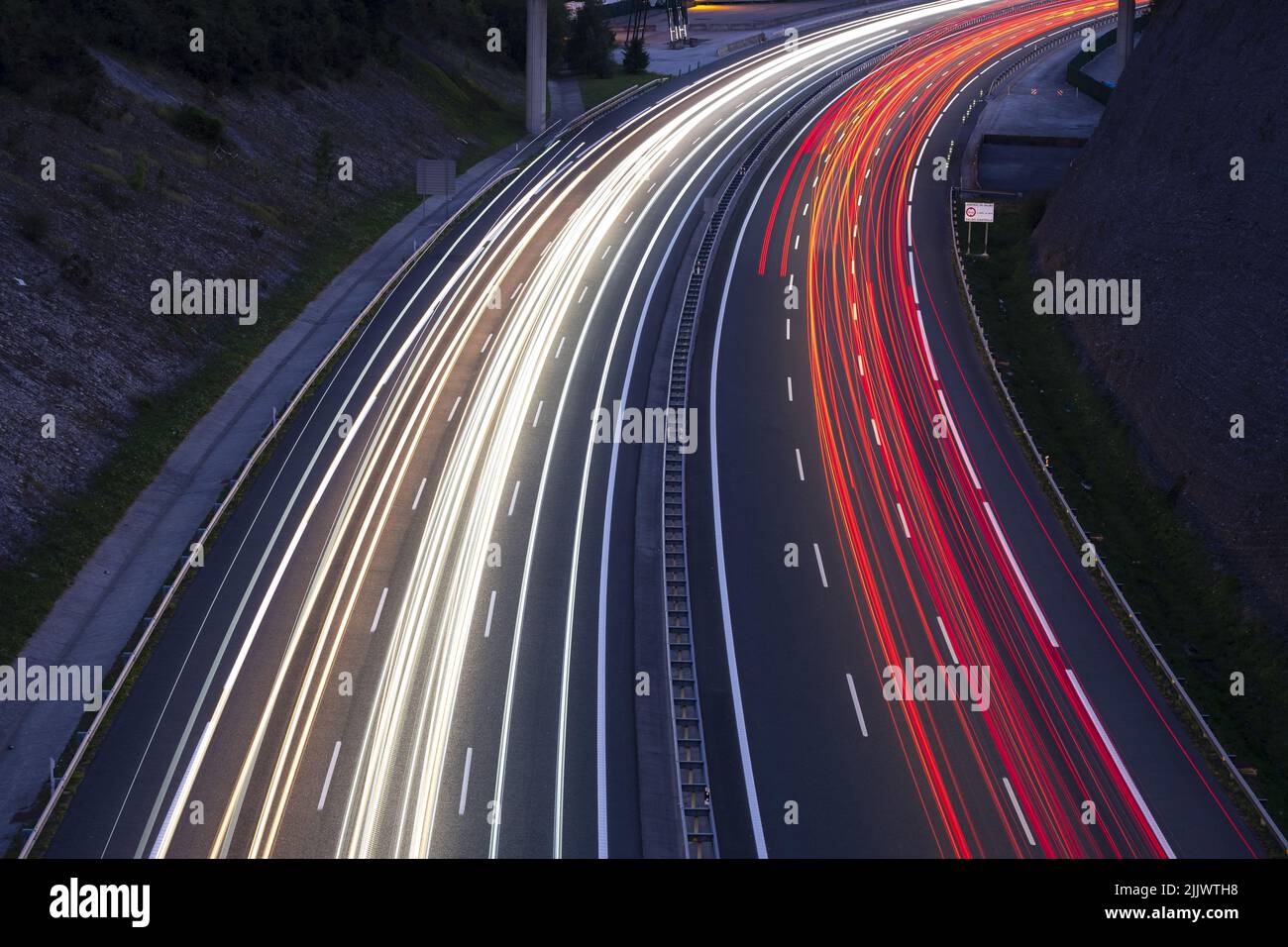 red and white trails of car lights on the freeway at night Stock Photo ...