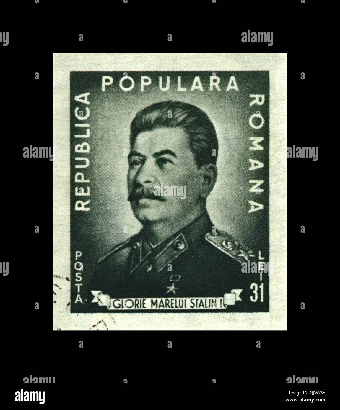 Joseph Stalin, famous soviet politician leader, 70th birth anniversary, circa 1949. The Soviet Army memorial. Vintage postal stamp of Romania isolated Stock Photo