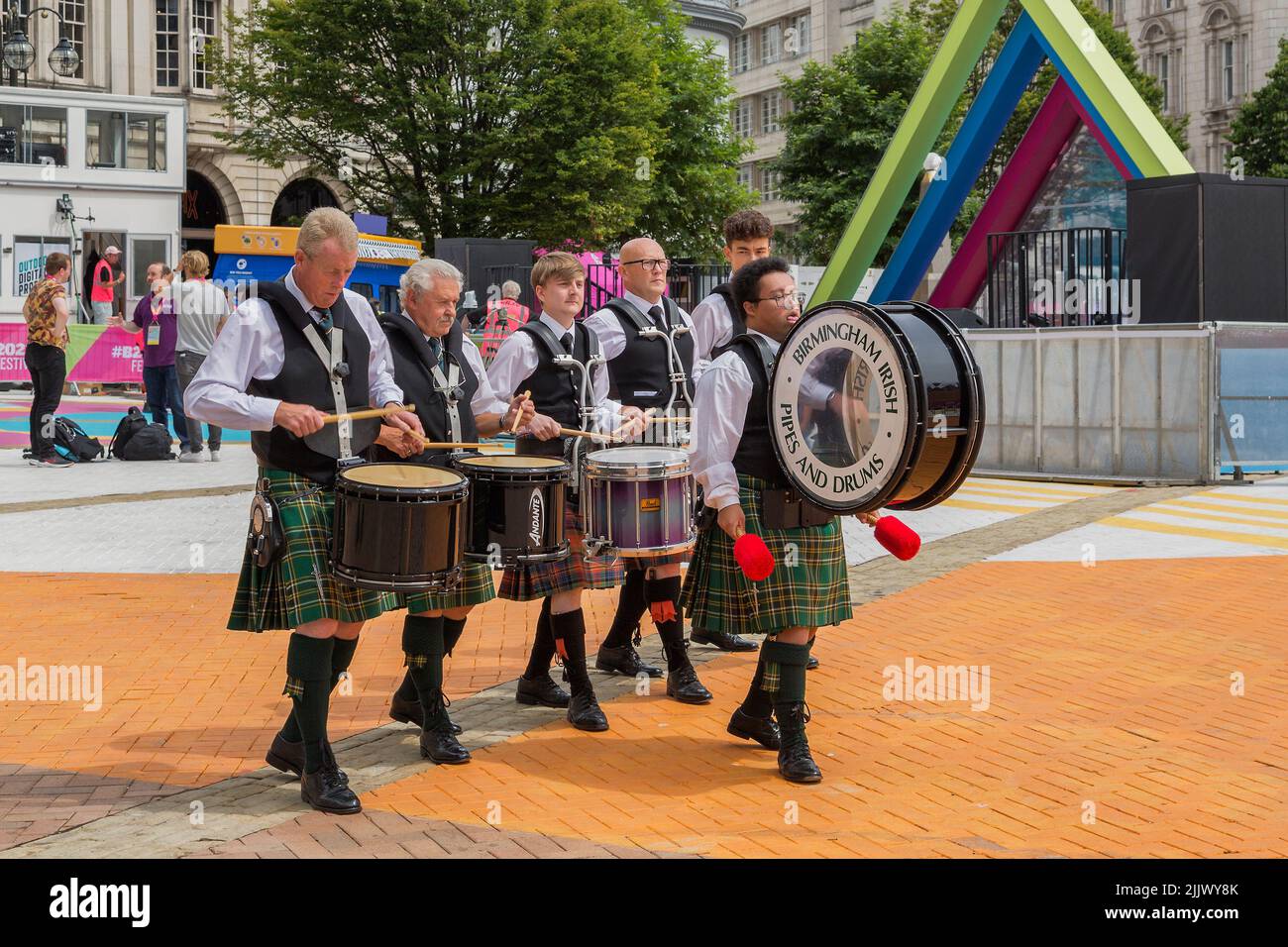 Birmingham Irish Pipes and Drums march in Victoria square, celebrating the 2022 Birmingham Commonwealth Games. Stock Photo