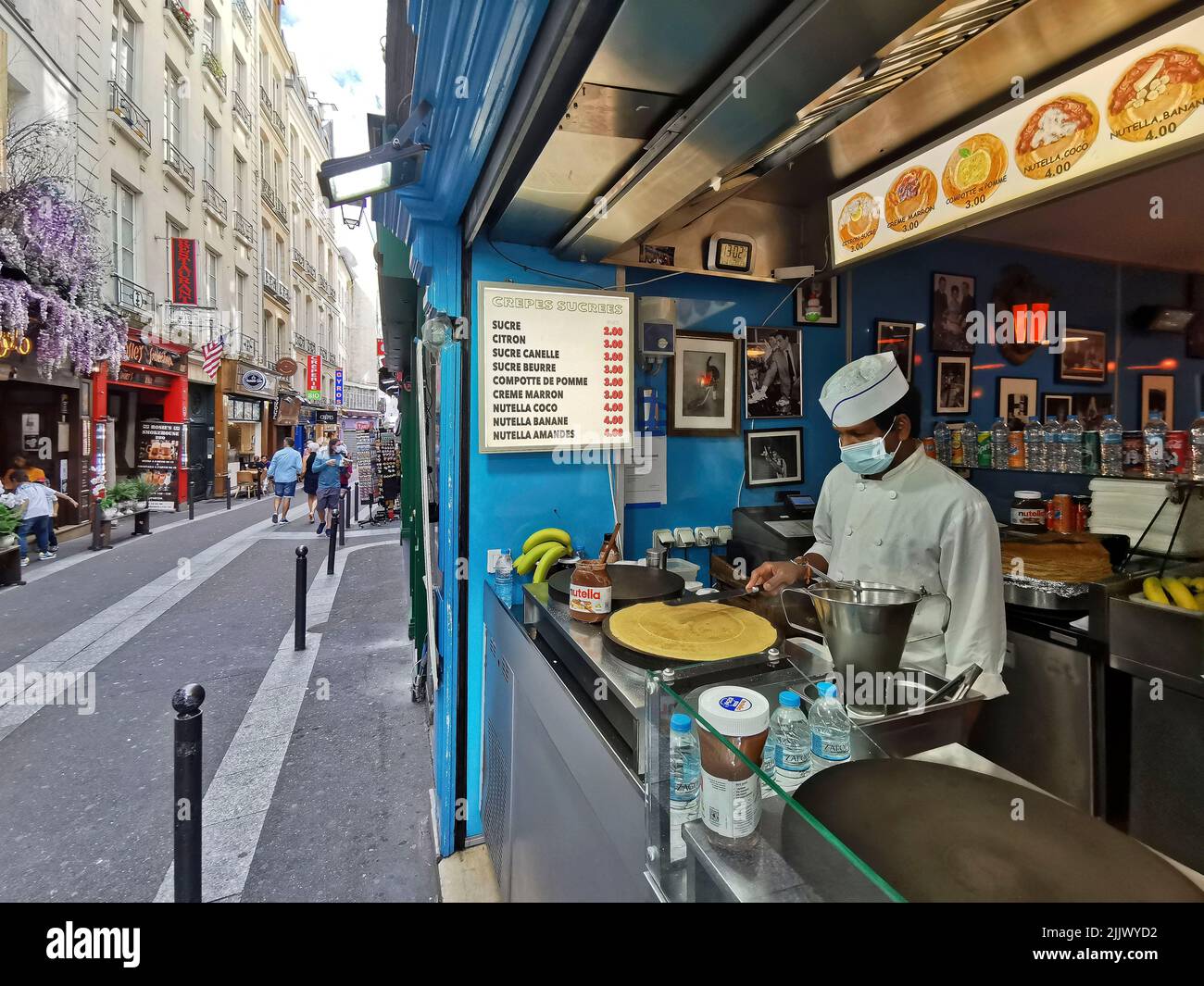France, Paris, Man making crepes at a Creperie   Photo © Fabio Mazzarella/Sintesi/Alamy Stock Photo Stock Photo