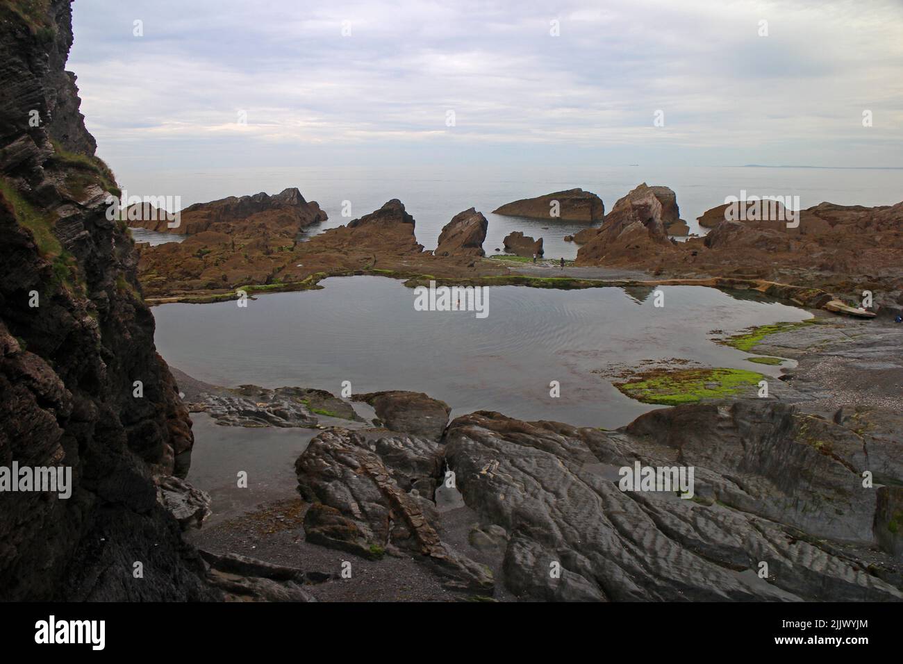 Tidal pool beach viewed from Tunnels Walk Stock Photo Alamy