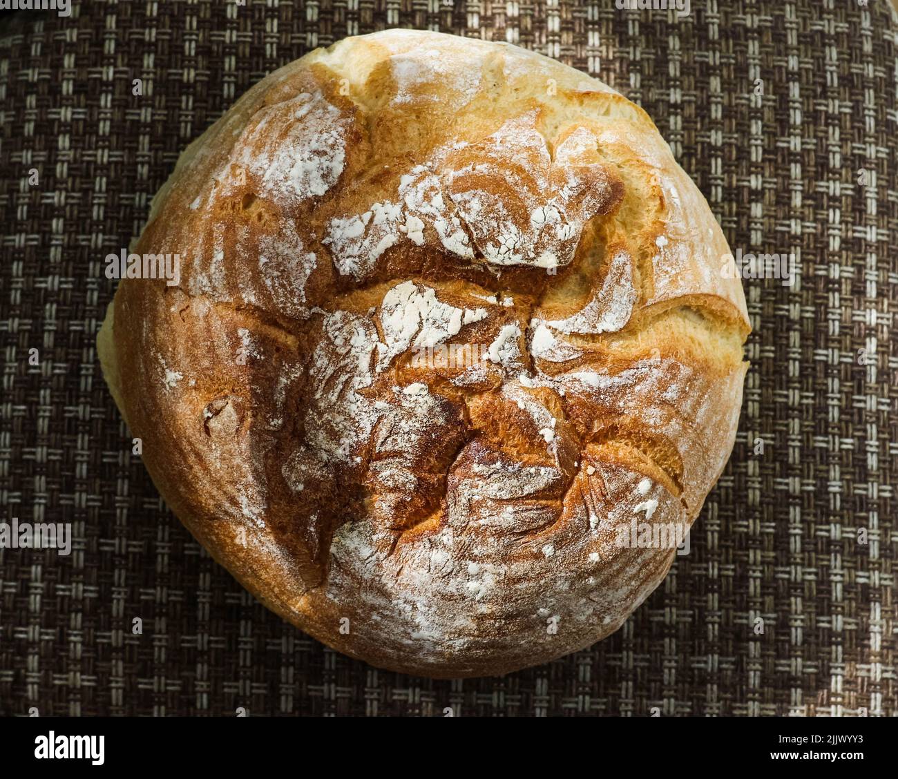 Bread is a staple food prepared from a dough of flour (usually wheat