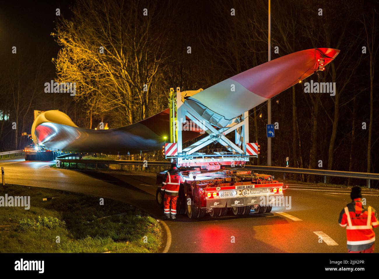 GERMANY, special transport of rotor blade SENVION 75,4m at night with heavy truck of company Torben Rafn Stock Photo