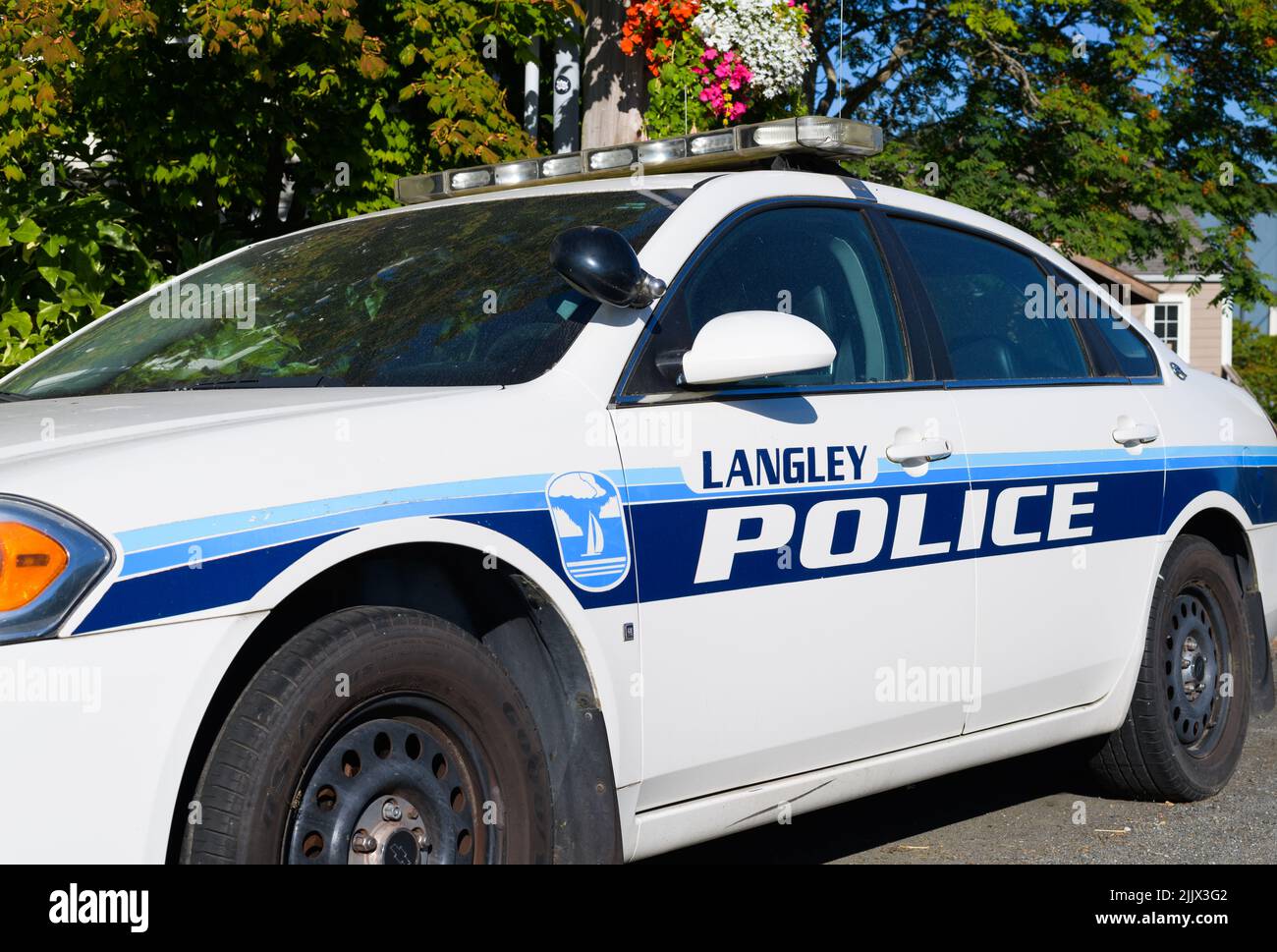Langley, WA, USA - July 26, 2022; City of Langley blue and white police car parked in summer Stock Photo