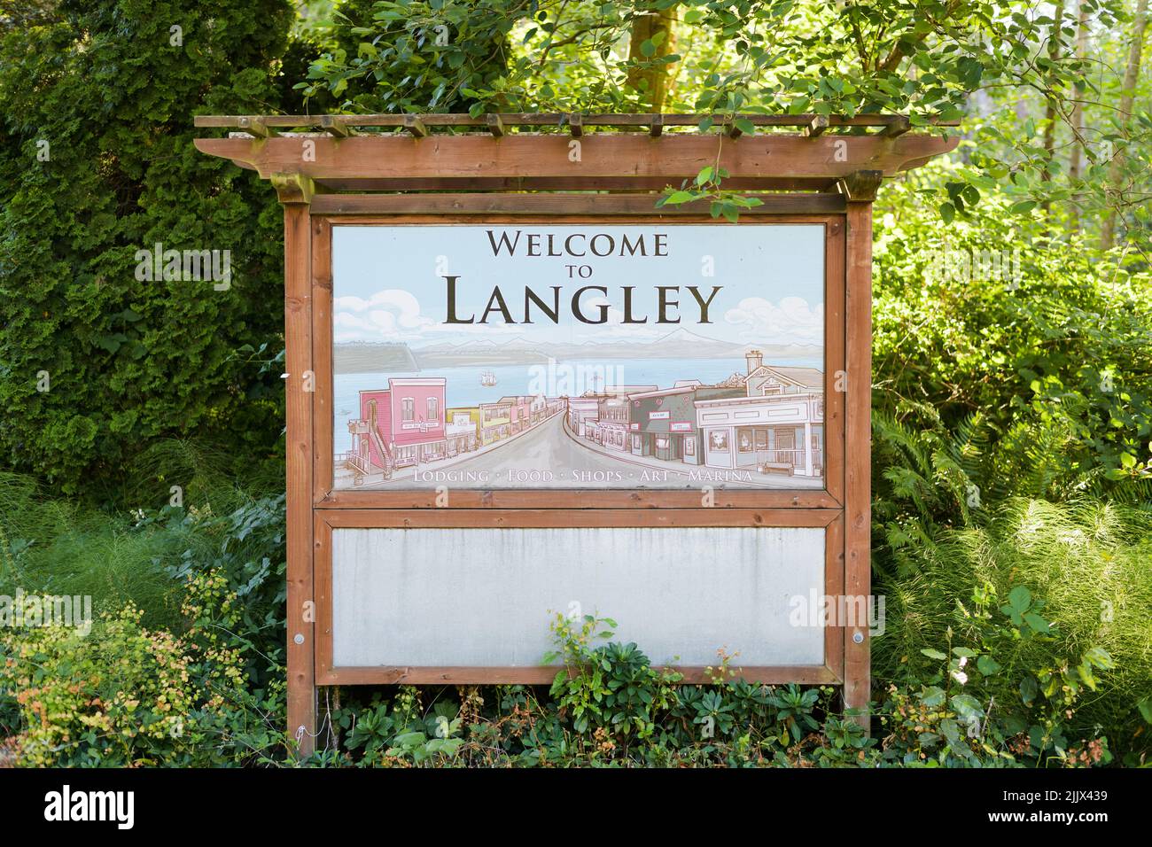 Langley, WA, USA - July 26, 2022; Wooden welcome sign to Langley on Whidbey Island Washington Stock Photo