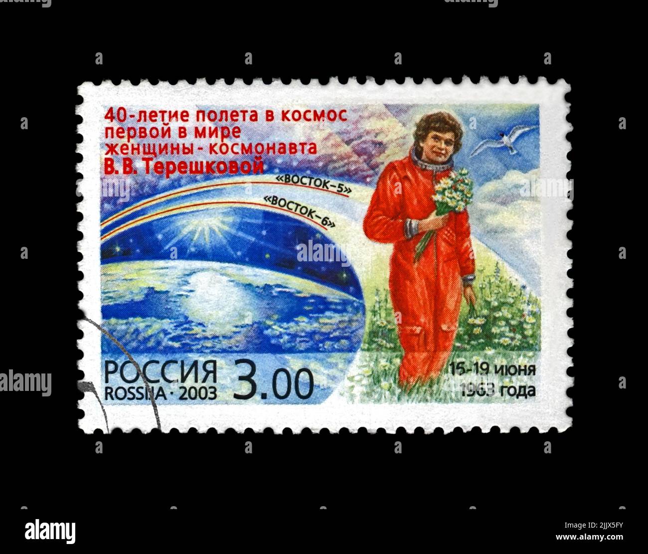 Valentina Tereshkova, soviet astronaut in red uniform with flowers, 1st woman in the space, blue sky, 40th anniversary of the space flight, circa 2003 Stock Photo