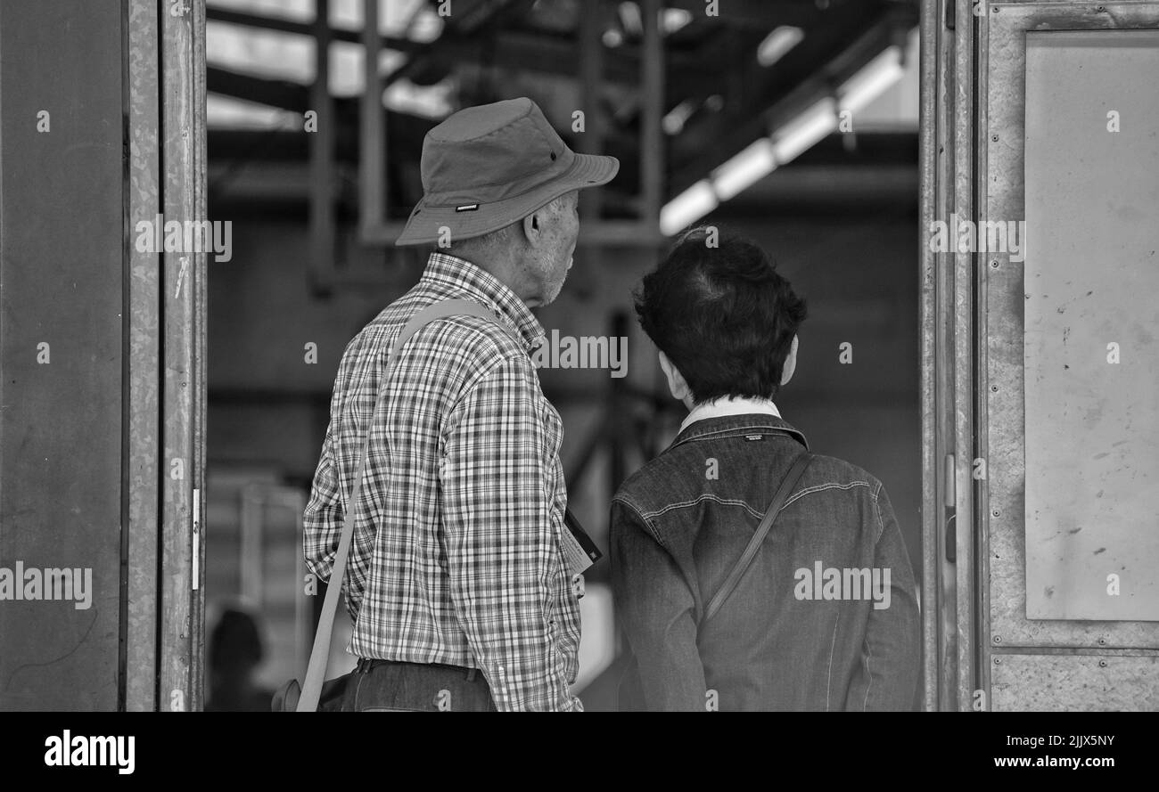 A view of a senior couple seen from behind Stock Photo