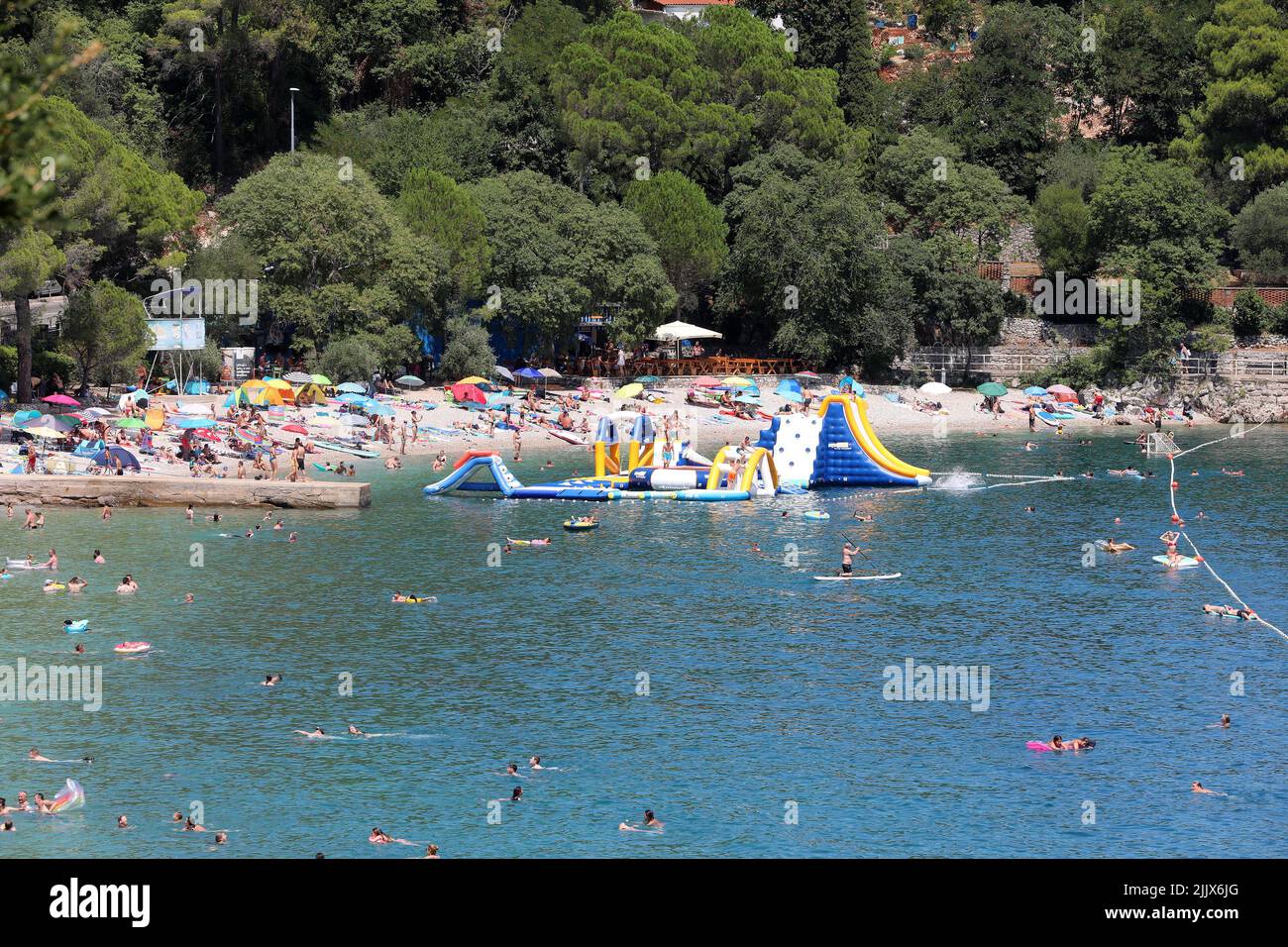 A large number of people found salvation from the unbearable heat on the beach, in Medveja, Croatia, on July 28, 2022. Photo: Goran Kovacic/PIXSELL Stock Photo