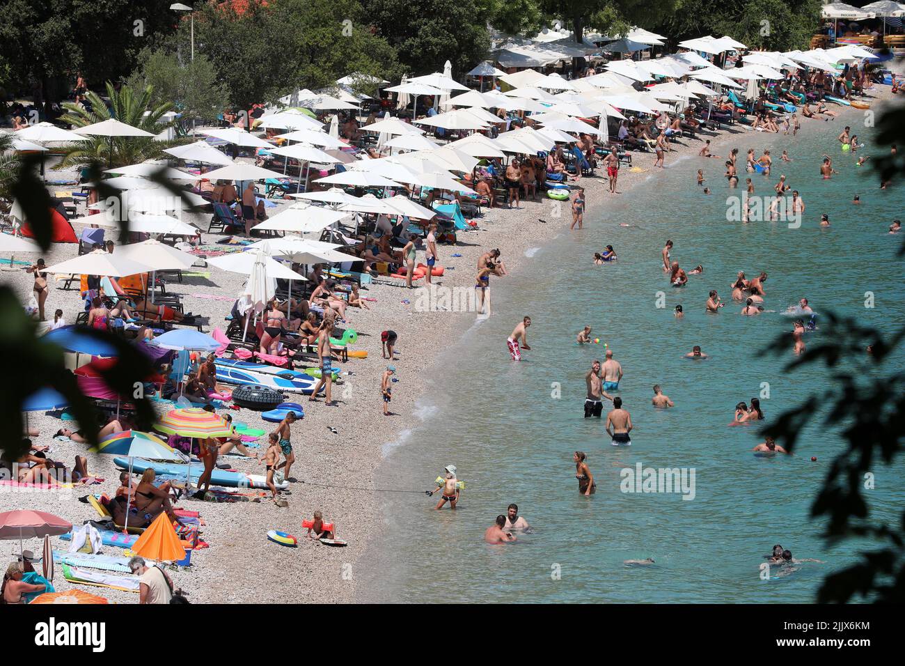 A large number of people found salvation from the unbearable heat on the beach, in Medveja, Croatia, on July 28, 2022. Photo: Goran Kovacic/PIXSELL Stock Photo