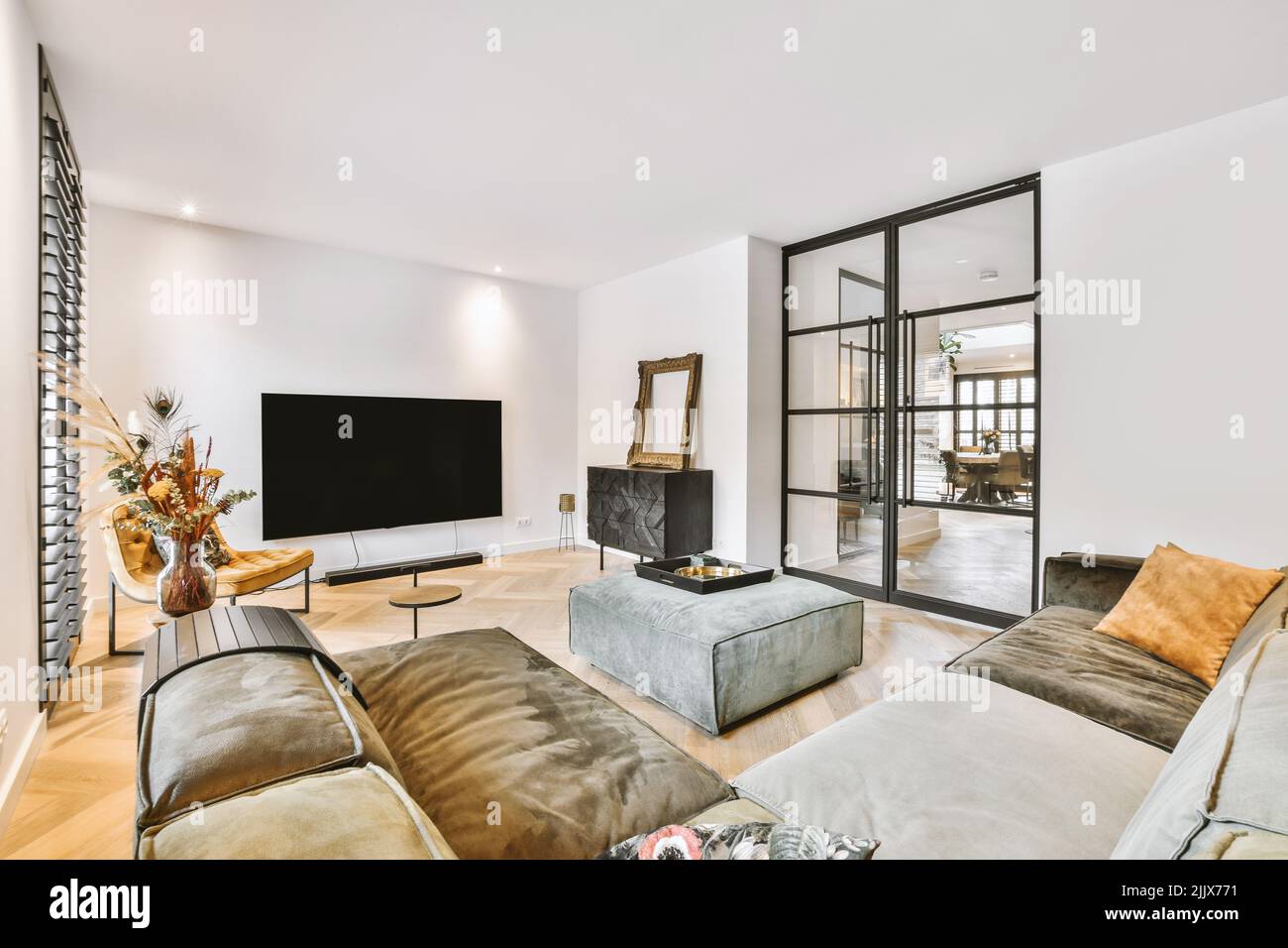 Modern interior of dining room with television by the wall Stock Photo ...