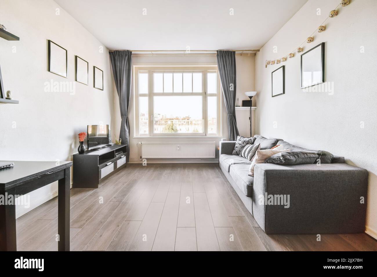 Interior of modern bright home with furniture next to a window Stock Photo Alamy