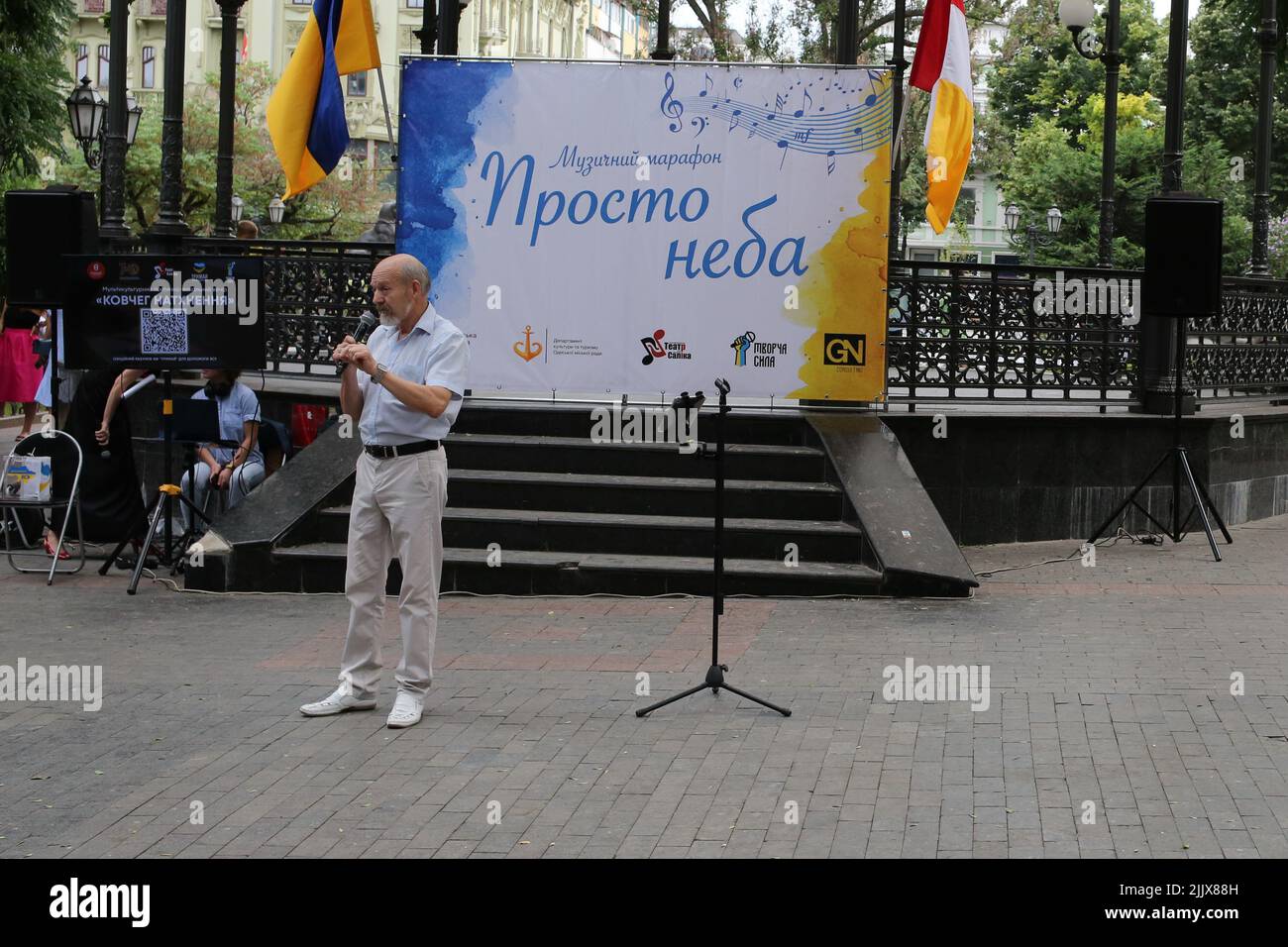 Odessa, Ukraine. 24th July, 2022. The poet Yuri Rabotin seen reciting a poem in Odessa region during the event. Multicultural poetic and vocal evening 'The ark of inspiration.' Poems and songs in Ukrainian, Polish, English, German, Spanish and French. A monitor was installed for the audience with the translation of works. The goal was to support the civilian population during the war with Russia. (Photo by Viacheslav Onyshchenko/SOPA Images/Sipa USA) Credit: Sipa USA/Alamy Live News Stock Photo