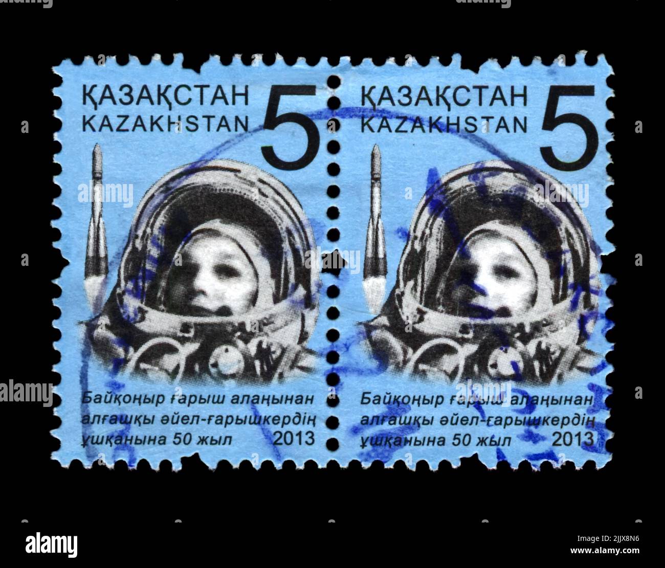 soviet astronaut Valentina Tereshkova, 1st woman in the space, circa 2013. canceled postal stamp printed in Kazakhstan isolated on black background. Stock Photo