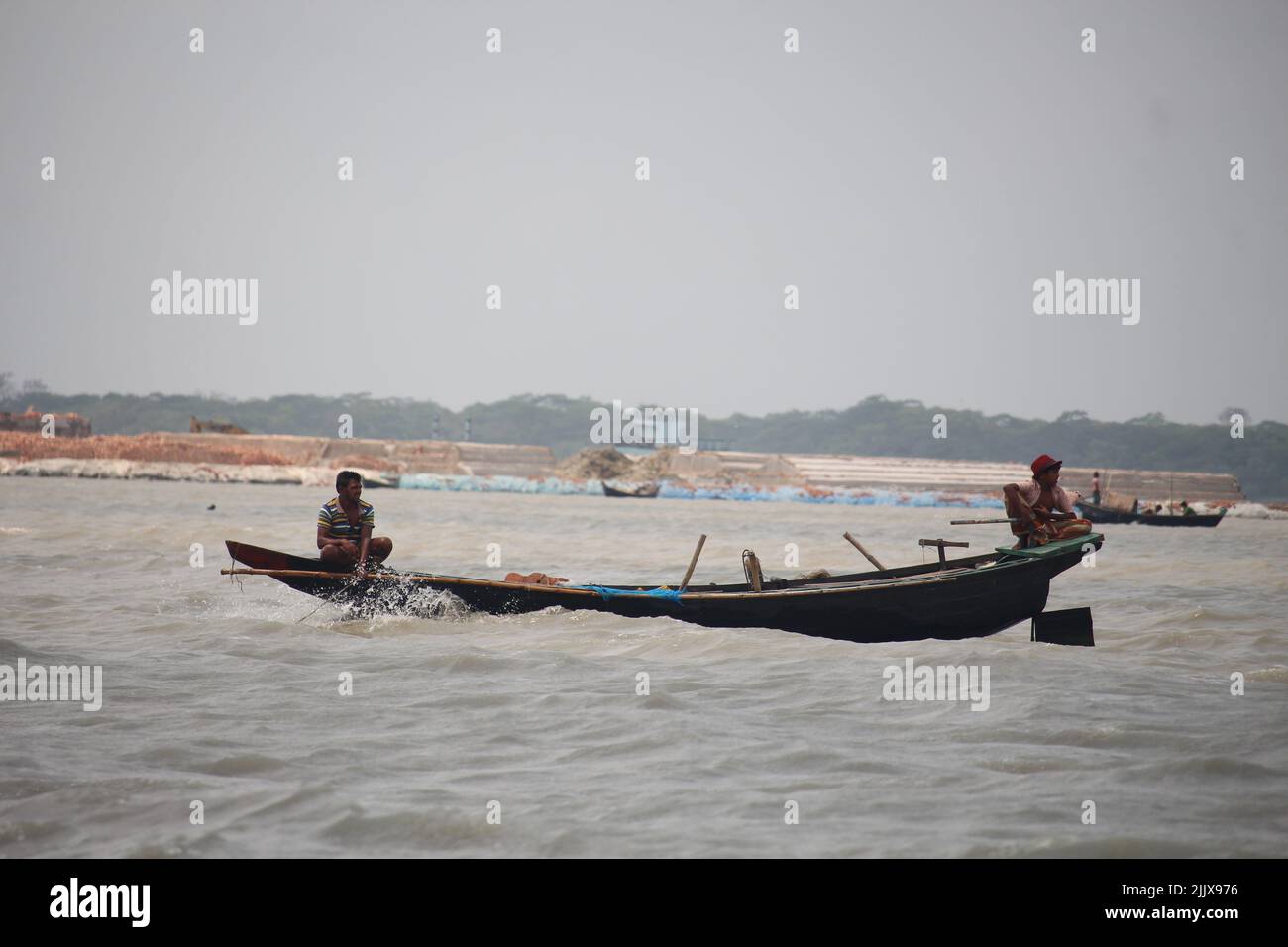 17-Apr-22 Babuganj, Barisal, Bangladesh.Small fishing boats are floating in the river. Stock Photo