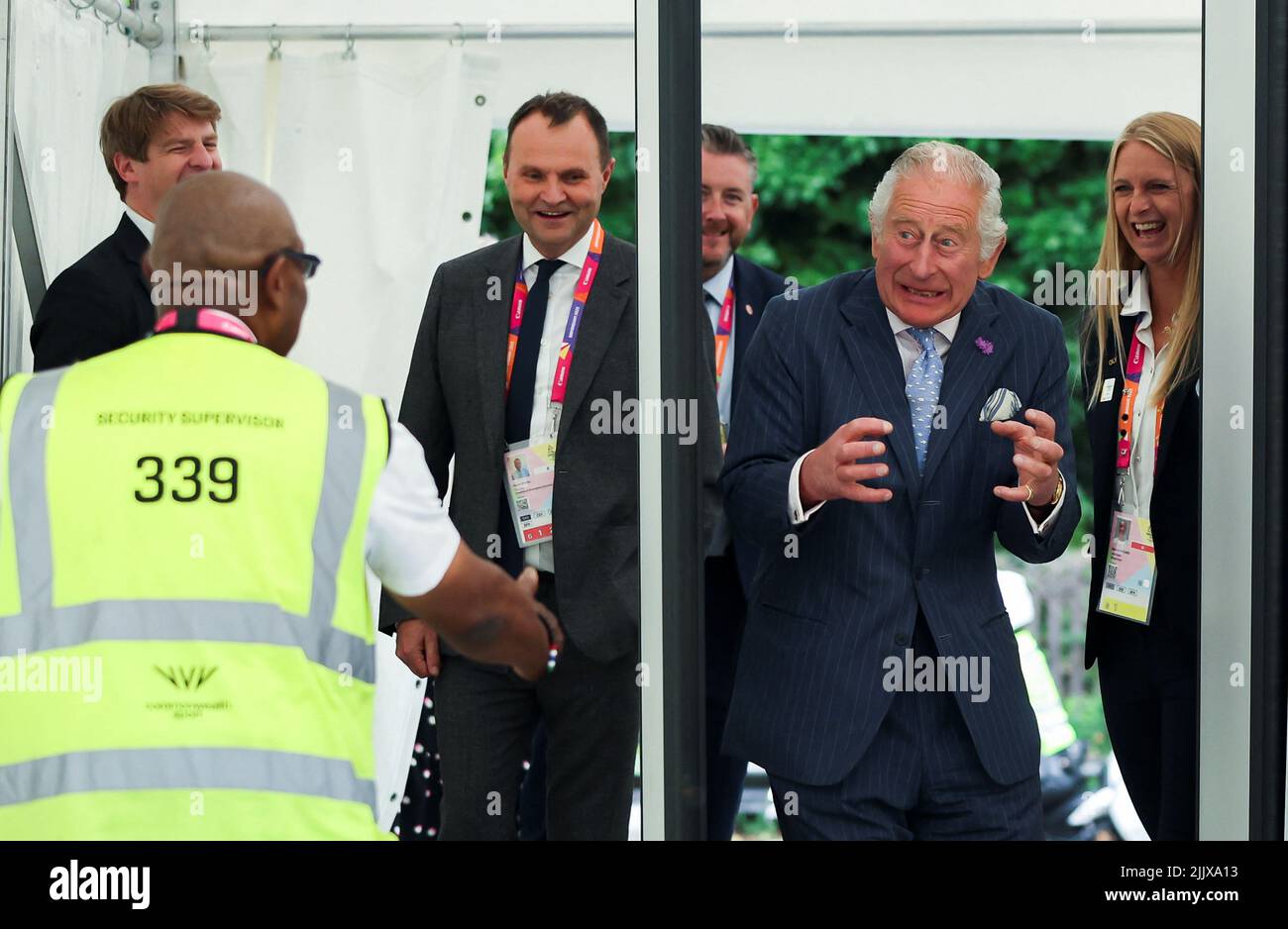 The Prince of Wales reacts as he walks through a metal detector during a visit to the Athletes Village at the University of Birmingham at the Birmingham 2022 Commonwealth Games. Picture date: Thursday July 28, 2022. Stock Photo