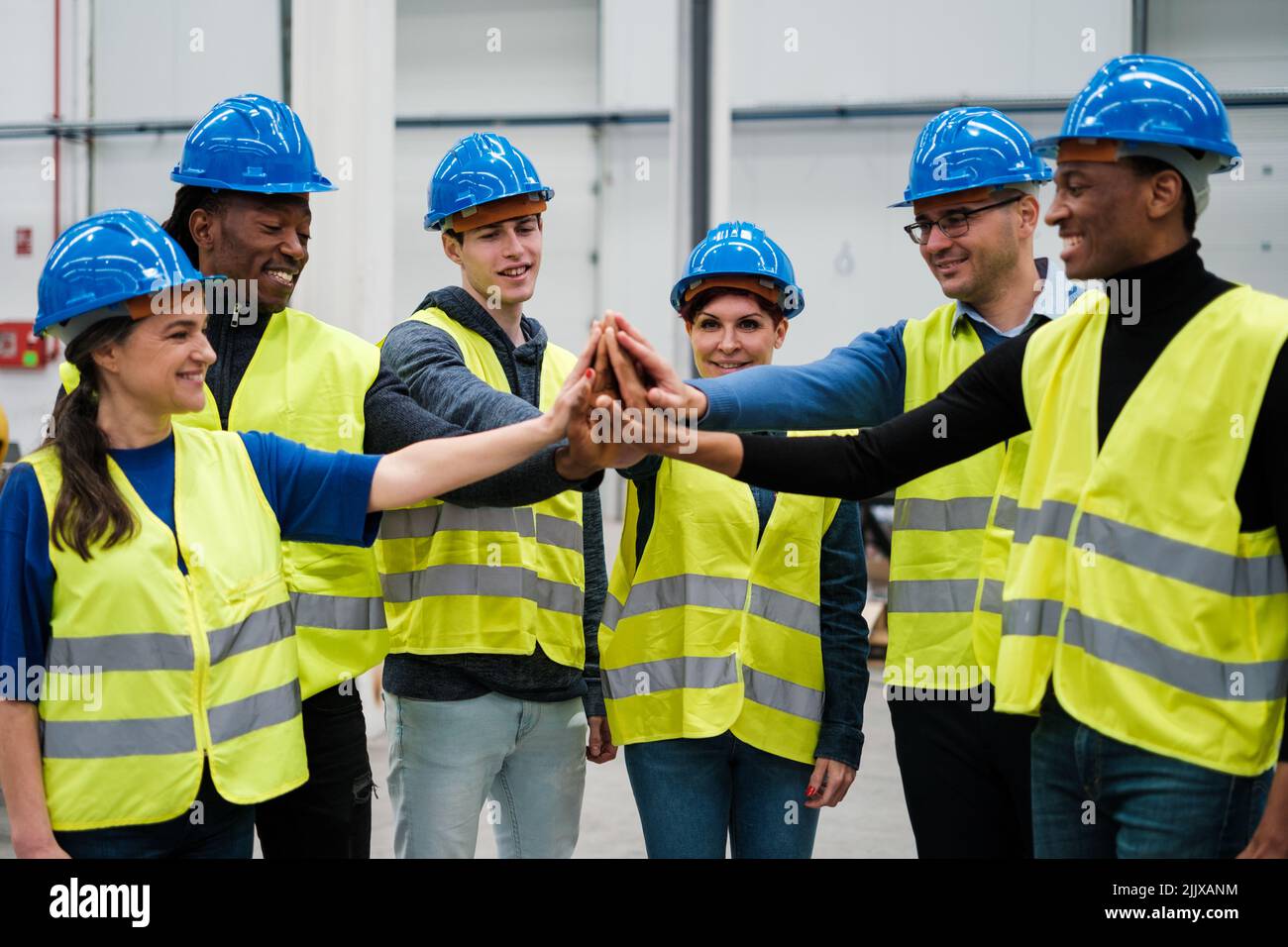 Group of engineers gathered to celebrate company successes Stock Photo