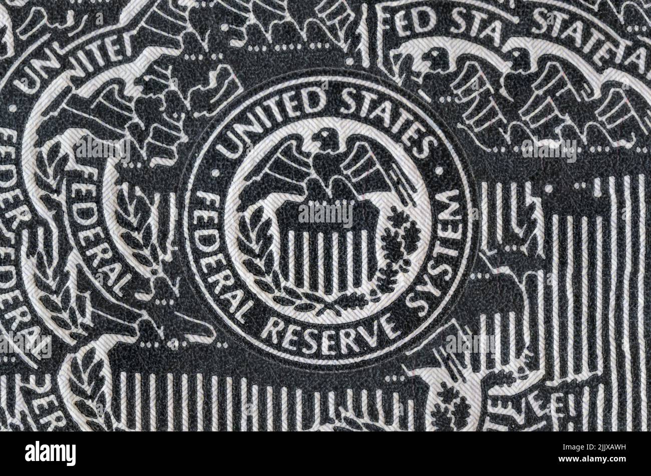 Distressed Federal Reserve System seal. The Fed's responsibilities include setting interest rates, managing the money supply, and regulating financial Stock Photo