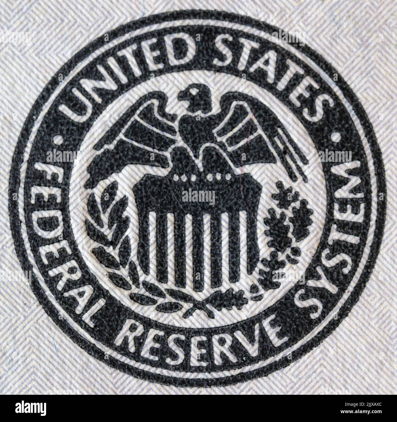 Federal Reserve System seal. The Fed's responsibilities include setting interest rates, managing the money supply, and regulating financial markets. Stock Photo