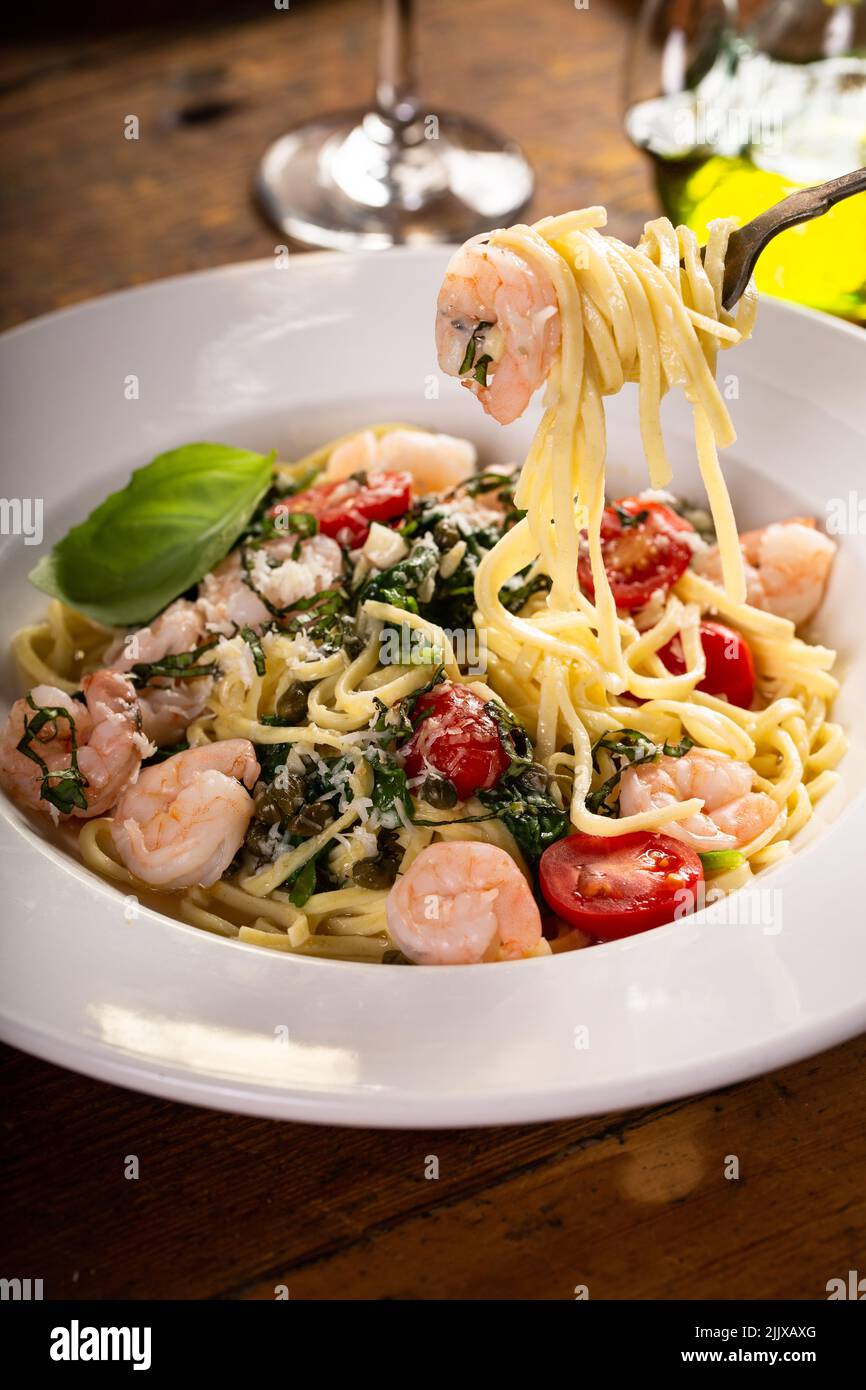 Fresh pasta linguine with shrimp and tomatoes Stock Photo Alamy