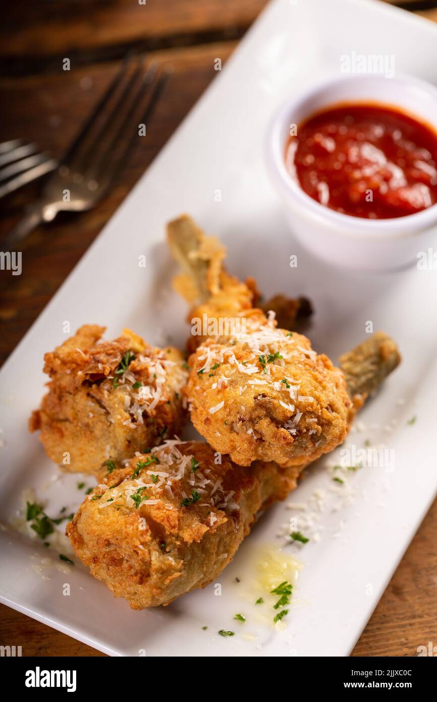 Italian fried lamb chops served with marinara sauce Stock Photo Alamy