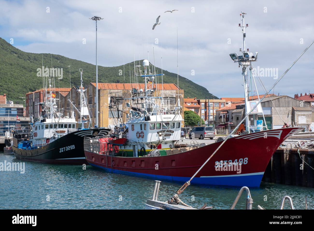 Moored trawlers in Santona harbour Stock Photo