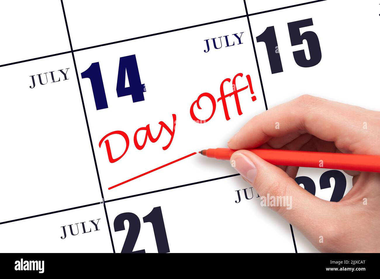 14th day of July. Hand writing text DAY OFF and drawing a line on calendar date 14 July. Vacation planning concept. Summer month, day of the year conc Stock Photo