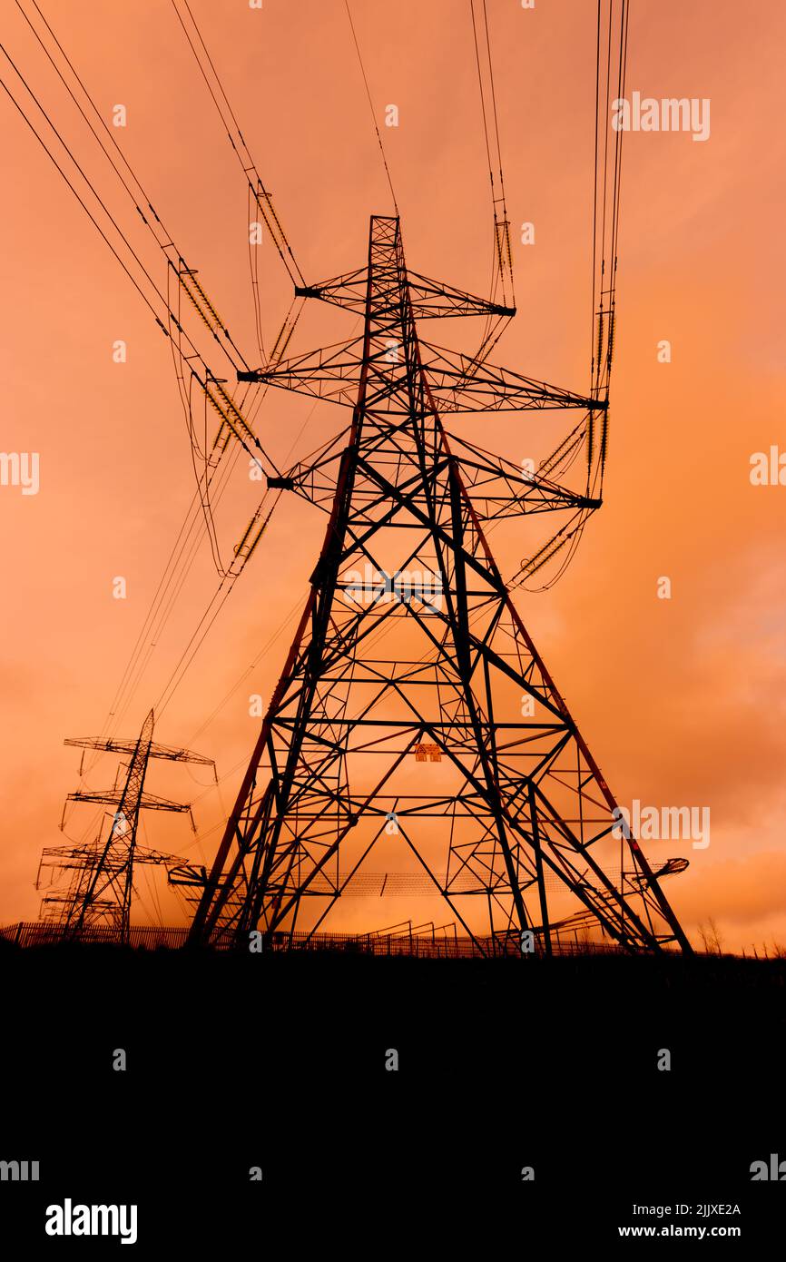 High voltage power pylon silhouette Stock Photo