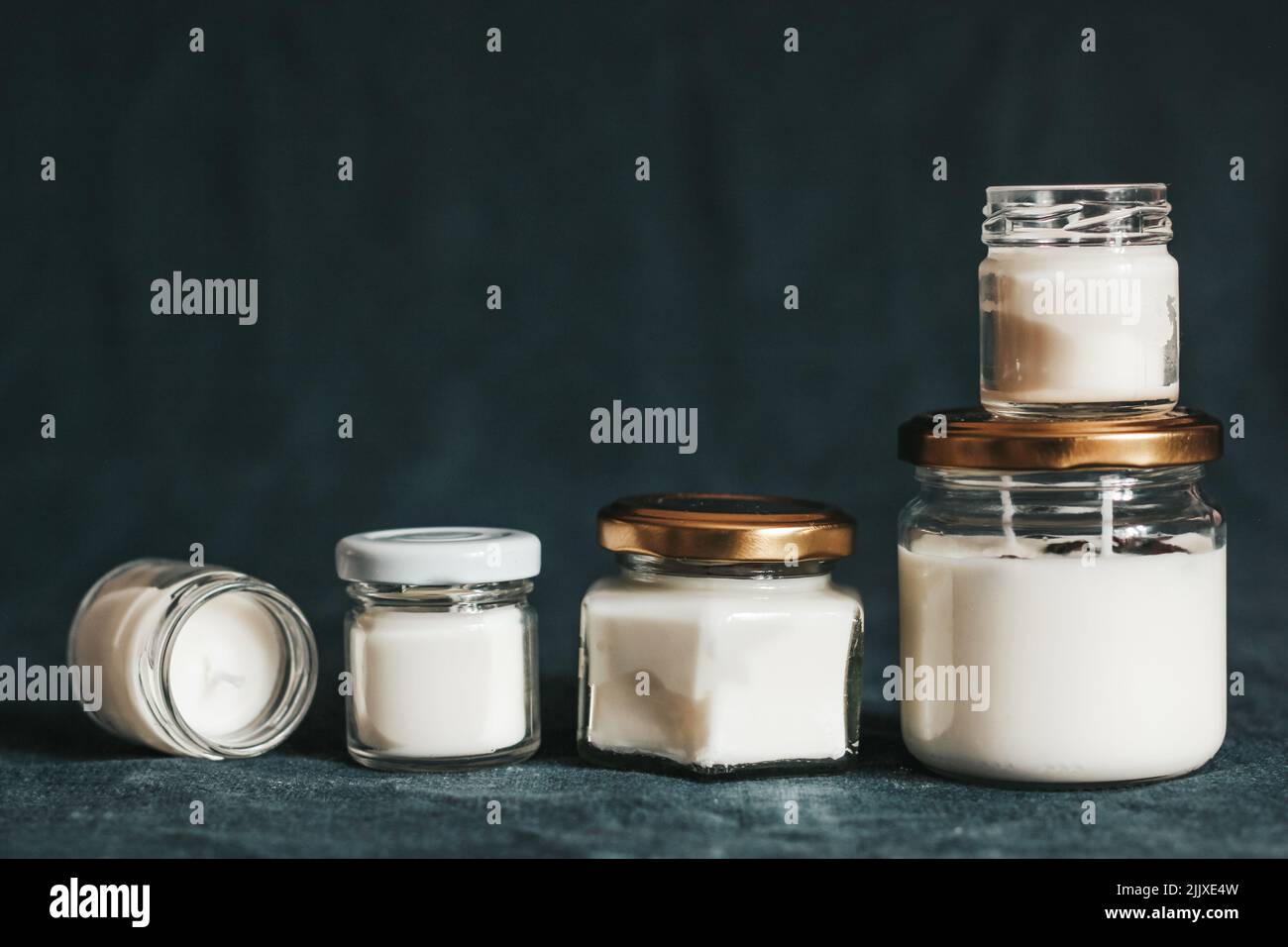 Scented candles in the interior. Candles in a jar on a blue background