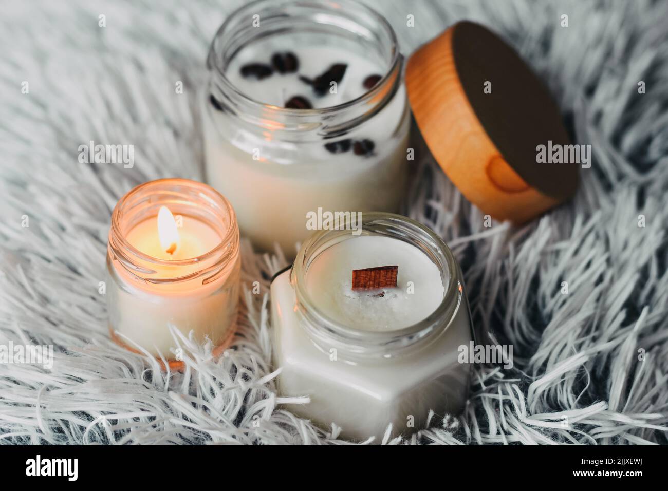 Scented candles in the interior. Interior details in milky and cold