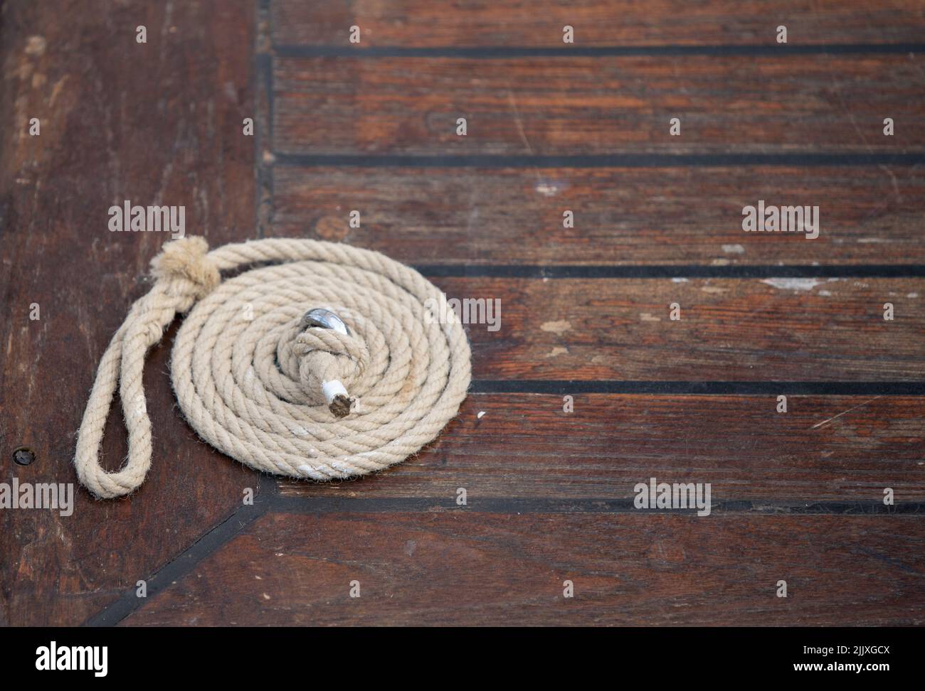 coiled rope on the deck of a ship Stock Photo