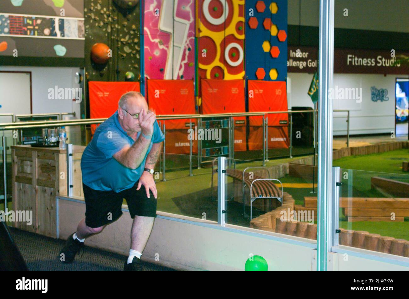Man, Male, Elderly, Playing Junior Ten Pin Bowling at Centre Parcs Longleat UK Stock Photo