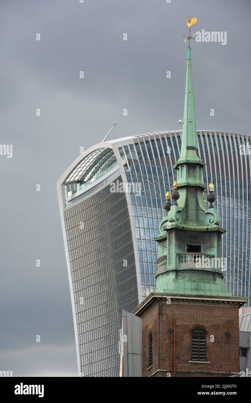 The 20 Fenchurch Street office building with the spire of the All Hallows-by-the-Tower church Stock Photo