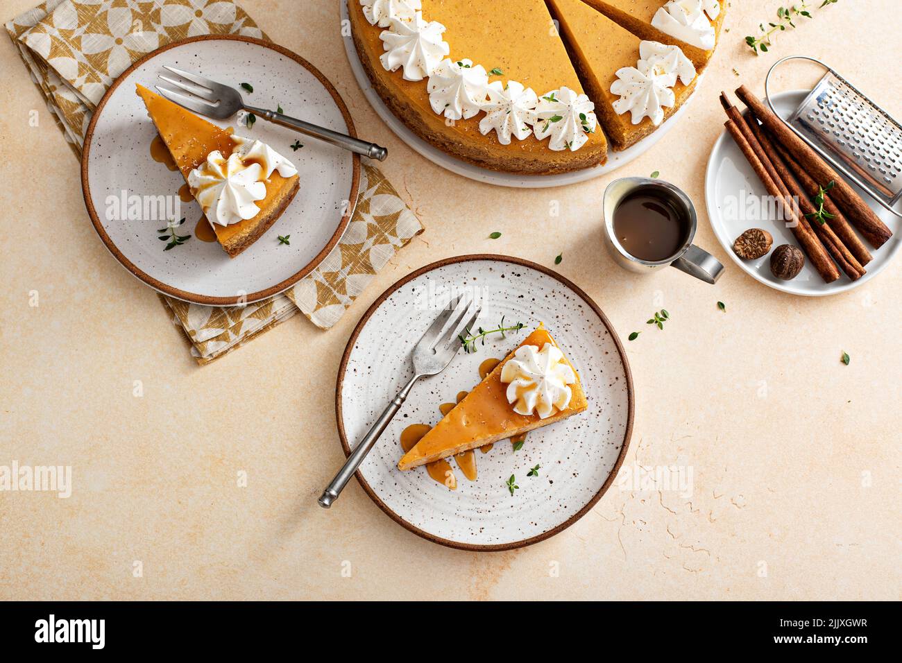 Pumpkin cheesecake with fall spices topped with whipped cream Stock