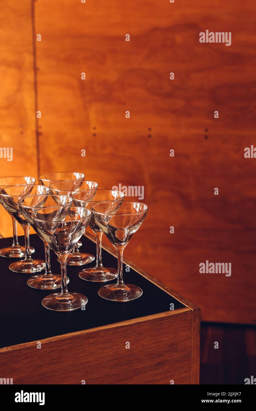 eight martini glasses lined up in rows Stock Photo Alamy