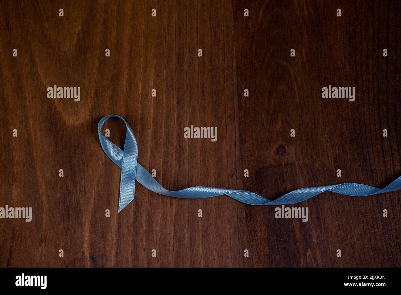 Rustic Cancer Ribbon Images Blue prostate cancer awareness ribbon on rustic wood table Stock Photo ...