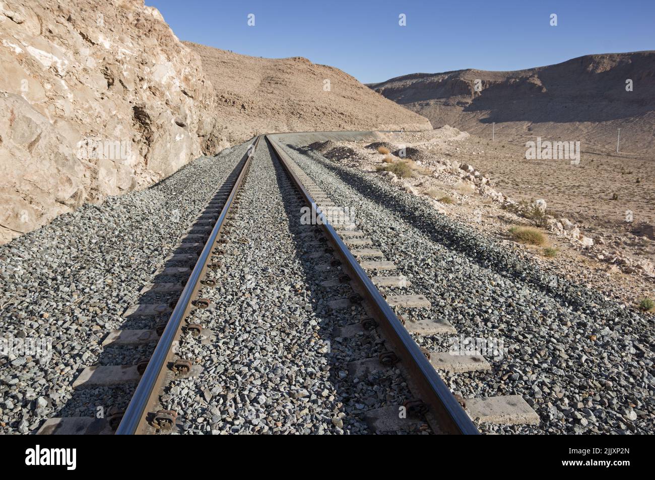 a railroad in the Nevada desert with concrete ties Stock Photo